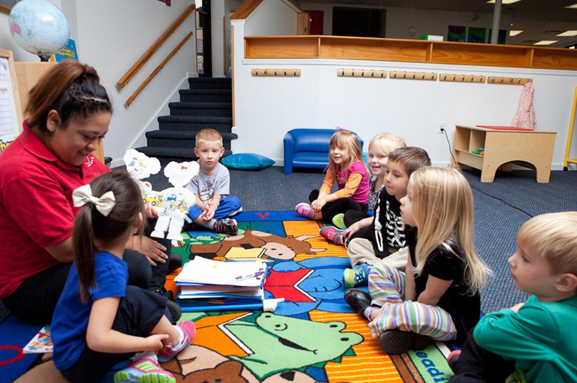 children reading books on the carpet