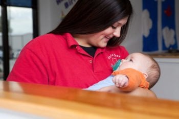 woman caring for an infant